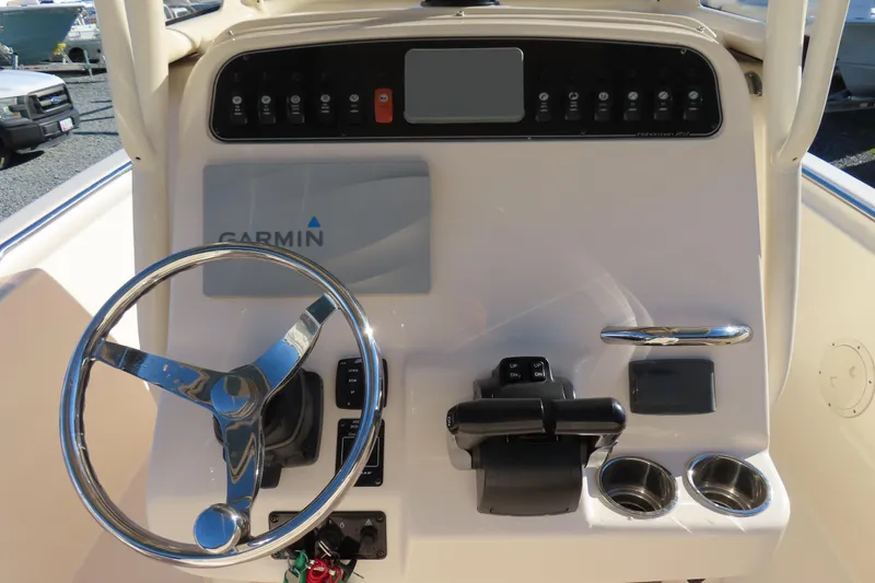 Slide: The Image of 2019 Grady-White Fisherman 257 boat console with Garmin navigation system and steering wheel. - 19
