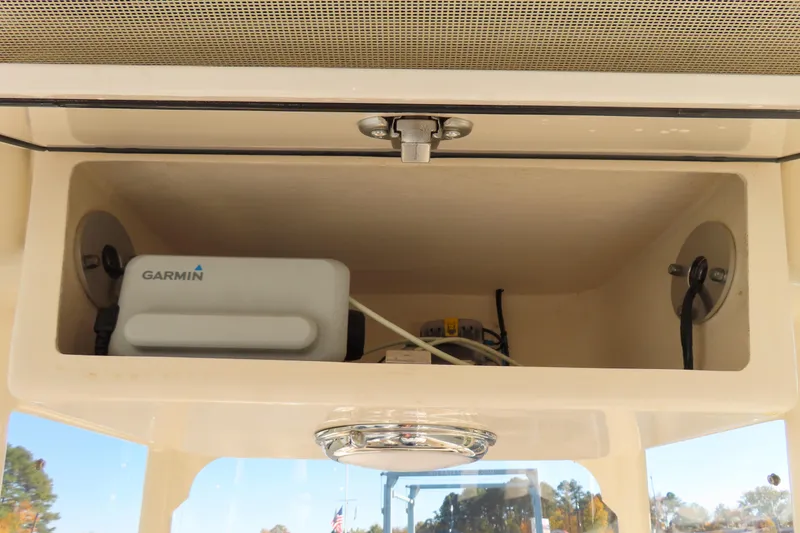 Slide: The Image of Storage compartment in 2019 Grady-White Fisherman 257 with Garmin device. - 21