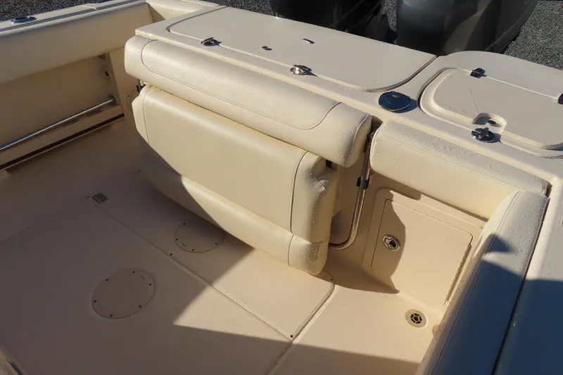 Slide: The Image of 2019 Grady-White Fisherman 257 boat interior with foldable seating and storage compartments. - 22