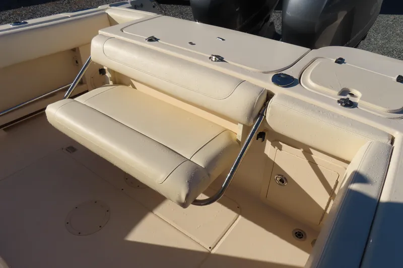 Slide: The Image of 2019 Grady-White Fisherman 257 boat interior with foldable seating and storage compartments. - 23