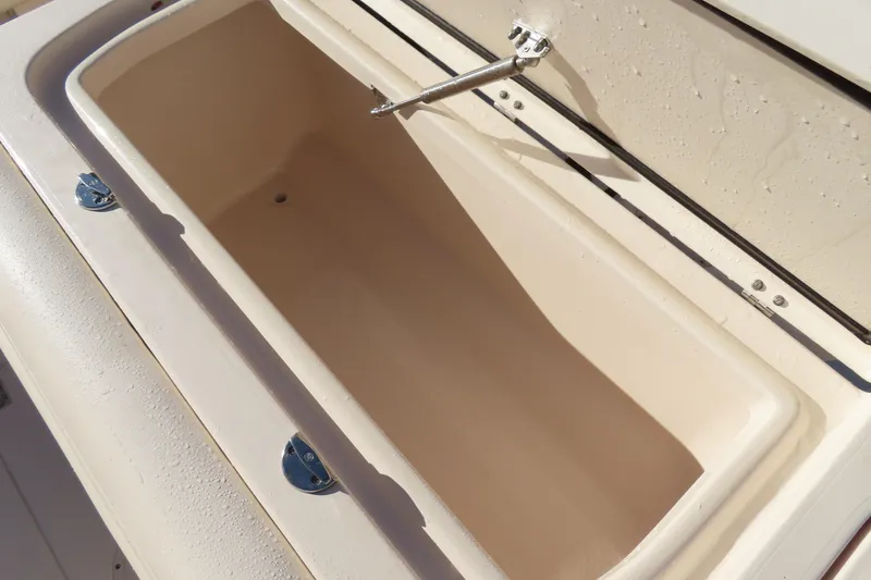 Slide: The Image of 2019 Grady-White Fisherman 257 boat storage compartment, open and empty. - 24