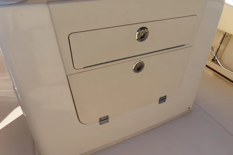 Slide: The Image of 2019 Grady-White Fisherman 257 boat storage compartment with secure latches. - 26