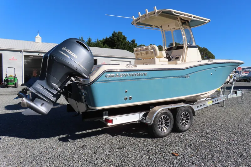 Slide: The Image of 2019 Grady-White Fisherman 257 boat on trailer with Yamaha engine, parked outdoors. - 3