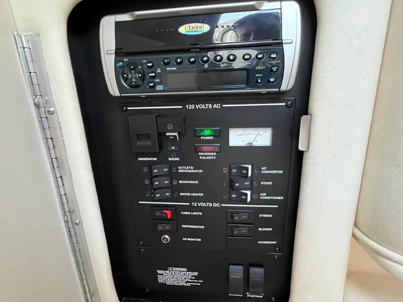 Slide: The Image of Control panel of a 2001 Sea Ray 260 Sundancer boat with Clarion stereo system. - 13