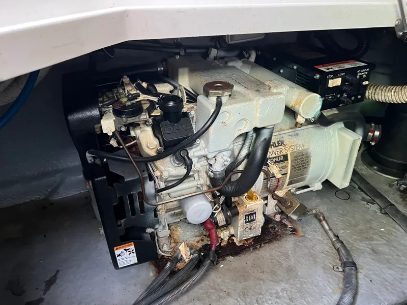 Slide: The Image of Engine compartment of a 2001 Sea Ray 260 Sundancer boat, featuring a Kohler power system. - 14
