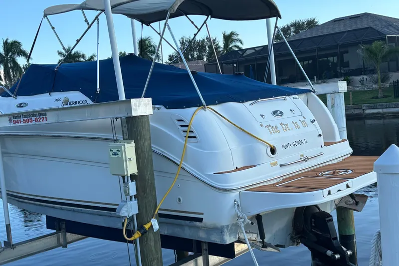Slide: The Image of 2001 Sea Ray 260 Sundancer docked, covered, in Punta Gorda, Florida. - 16