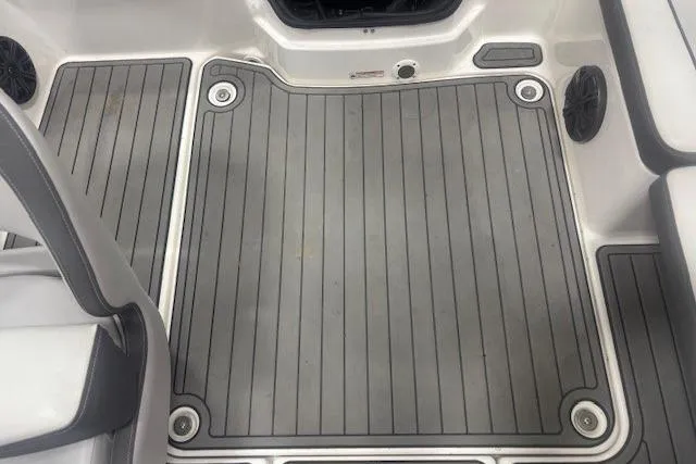 Slide: The Image of 2019 Yamaha AR190 boat interior with gray non-slip flooring and seating. - 13