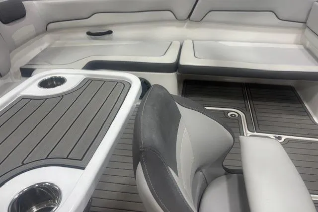 Slide: The Image of 2019 Yamaha Boats AR190 interior with seating, table, and cup holders. - 27