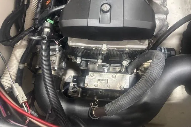 Slide: The Image of Engine compartment of a 2019 Yamaha Boats AR190, showcasing intricate wiring and components. - 34