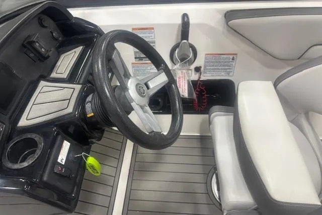 Slide: The Image of 2019 Yamaha Boats AR190 cockpit with steering wheel and seating area. - 43