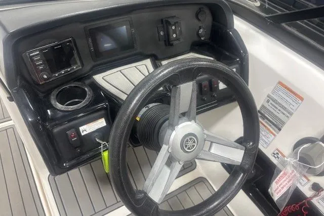 Slide: The Image of 2019 Yamaha Boats AR190 dashboard with steering wheel and control panel. - 53
