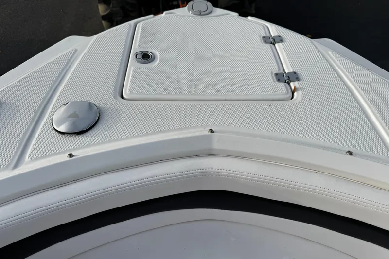 Slide: The Image of 2019 Chaparral 246 SSi boat deck with textured surface and hatch. - 10