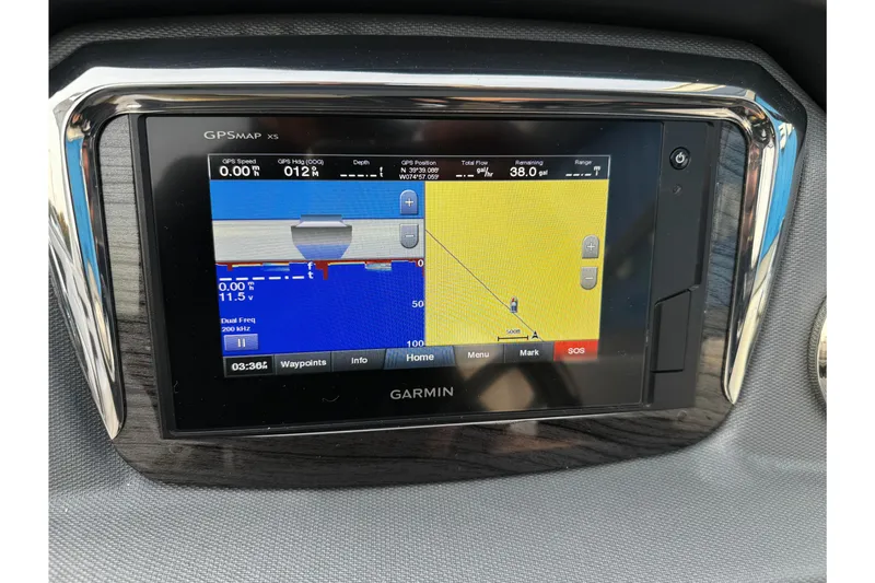 Slide: The Image of Garmin GPS display on 2019 Chaparral 246 SSi boat dashboard, showing navigation and depth data. - 12