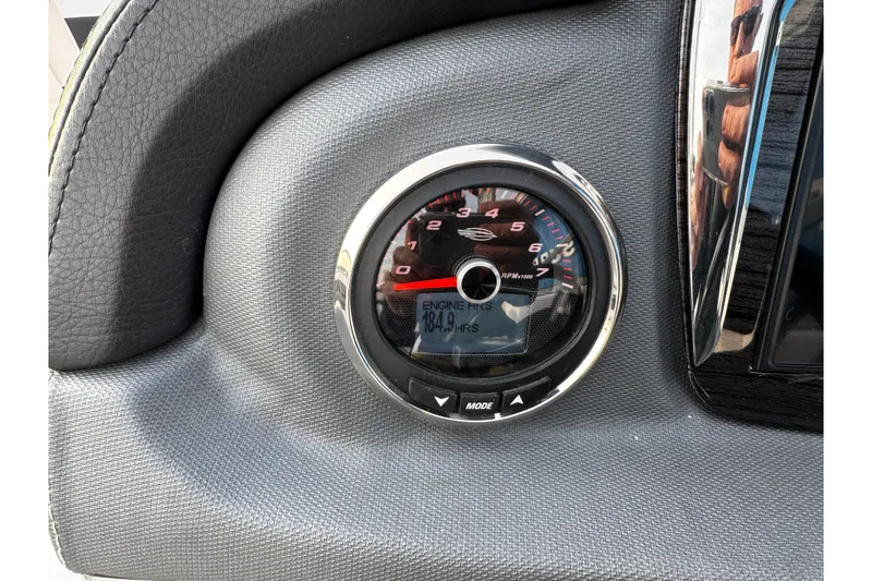 Slide: The Image of Tachometer of 2019 Chaparral 246 SSi boat showing engine hours and RPM. - 16