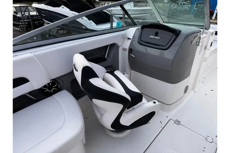 Slide: The Image of Interior of 2019 Chaparral 246 SSi boat with sleek seating and dashboard. - 22