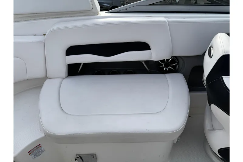 Slide: The Image of 2019 Chaparral 246 SSi boat interior with white seating and speaker detail. - 31