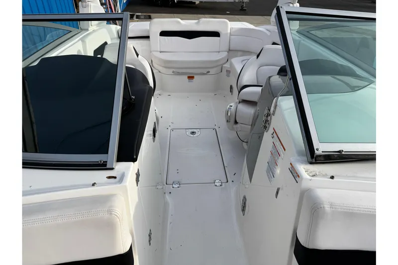 Slide: The Image of 2019 Chaparral 246 SSi boat interior with white seating and open cockpit design. - 41