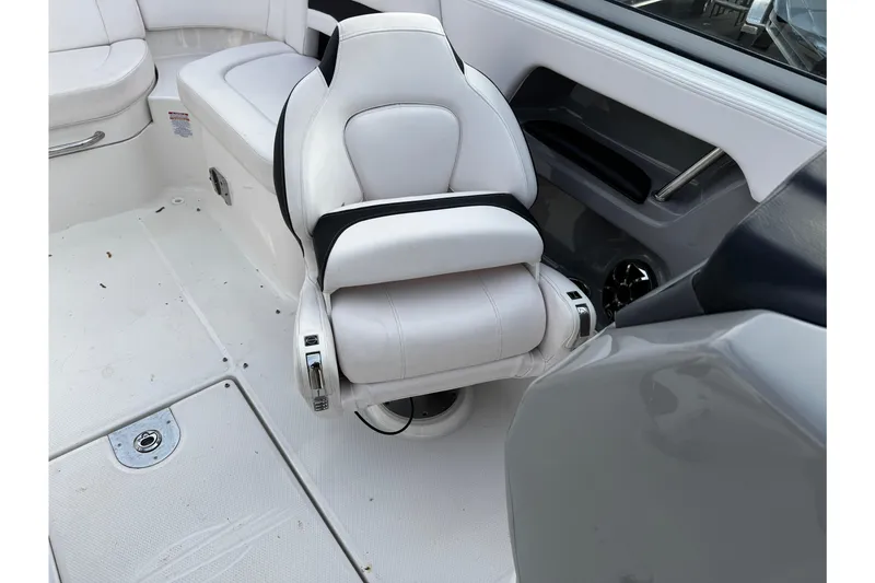 Slide: The Image of 2019 Chaparral 246 SSi boat interior with white seating and sleek design. - 42