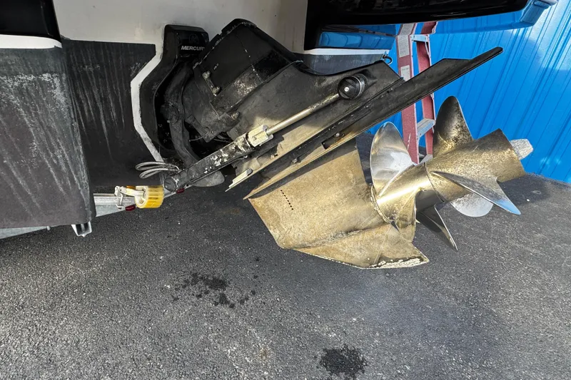 Slide: The Image of Close-up of a 2019 Chaparral 246 SSi boat propeller and outdrive on asphalt. - 47