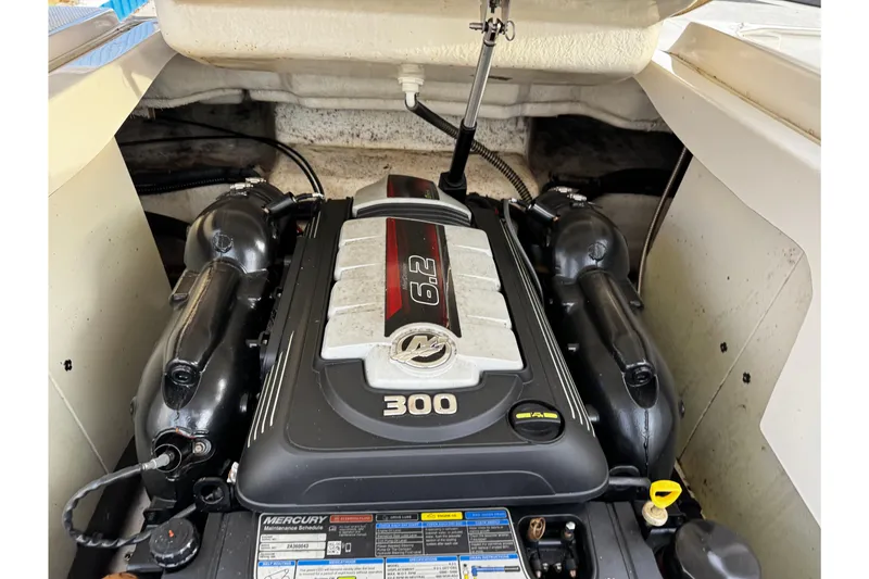 Slide: The Image of Engine compartment of 2019 Chaparral 246 SSi boat with Mercury 300 horsepower engine. - 49