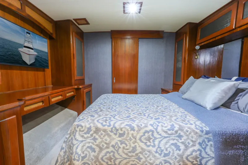 Slide: The Image of Luxurious bedroom in a 1985 Monterey Convertible boat. - 11
