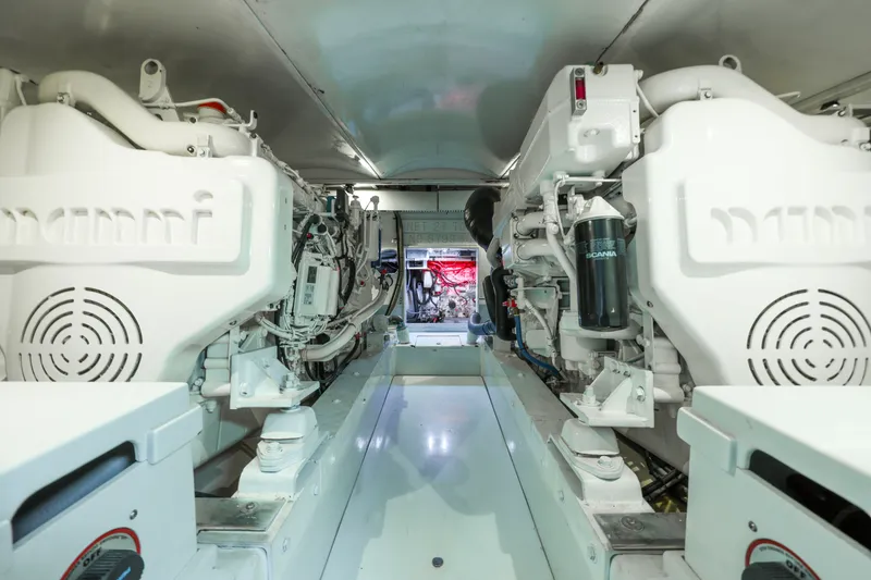 Slide: The Image of Engine room of a 1985 Monterey Convertible boat, clean and well-organized. - 14