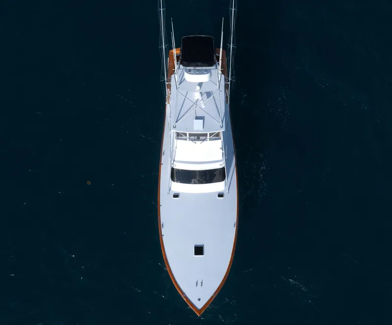 Slide: The Image of Aerial view of a 1985 Monterey Convertible boat on the water. - 3