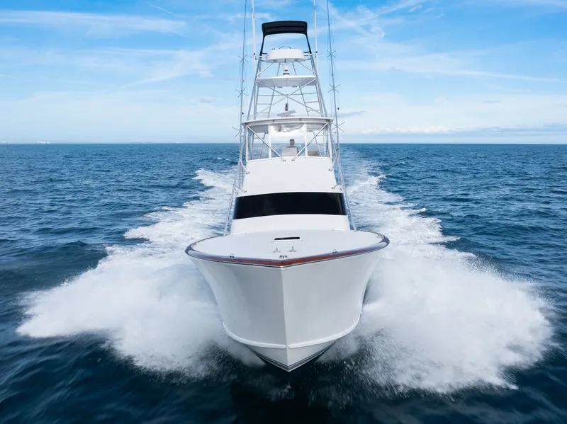 Slide: The Image of 1985 Monterey Convertible yacht cruising on open sea. - 6