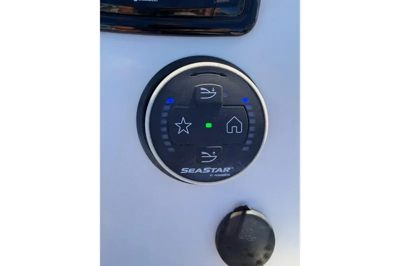 Slide: The Image of Control panel of 2022 Sea Chaser 21 Sea Skiff boat, featuring SeaStar by Dometic. - 13