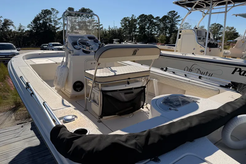 Slide: The Image of 2022 Sea Chaser 21 Sea Skiff boat with center console and seating, parked outdoors. - 19