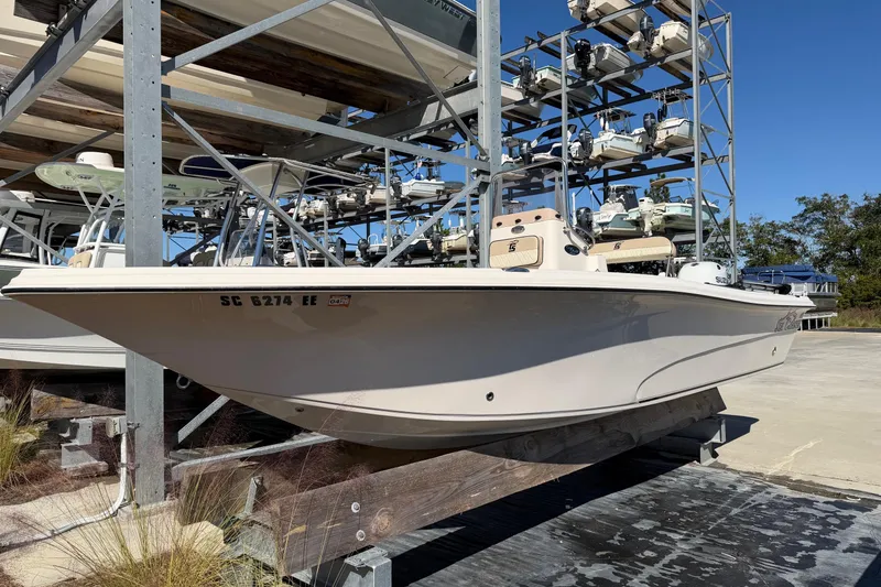 Slide: The Image of 2022 Sea Chaser 21 Sea Skiff boat in storage, side view. - 2