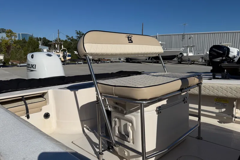 Slide: The Image of 2022 Sea Chaser 21 Sea Skiff boat with Suzuki outboard motor, beige seating. - 21