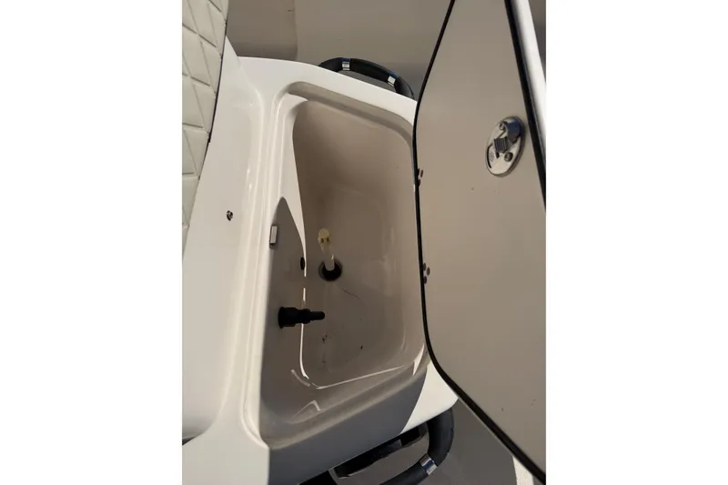 Slide: The Image of 2022 Sea Chaser 21 Sea Skiff storage compartment with open lid. - 28
