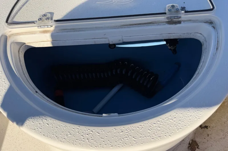 Slide: The Image of Open storage compartment on 2022 Sea Chaser 21 Sea Skiff boat. - 29