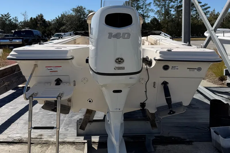 Slide: The Image of 2022 Sea Chaser 21 Sea Skiff boat with 140 horsepower engine, rear view. - 3