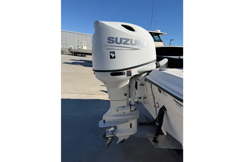 Slide: The Image of Outboard motor on 2022 Sea Chaser 21 Sea Skiff, featuring Suzuki branding. - 32