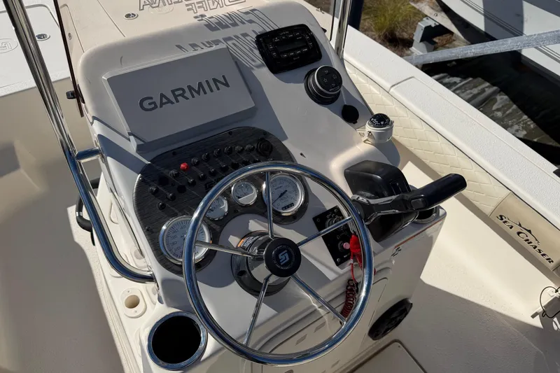 Slide: The Image of 2022 Sea Chaser 21 Sea Skiff boat dashboard with Garmin navigation system. - 9