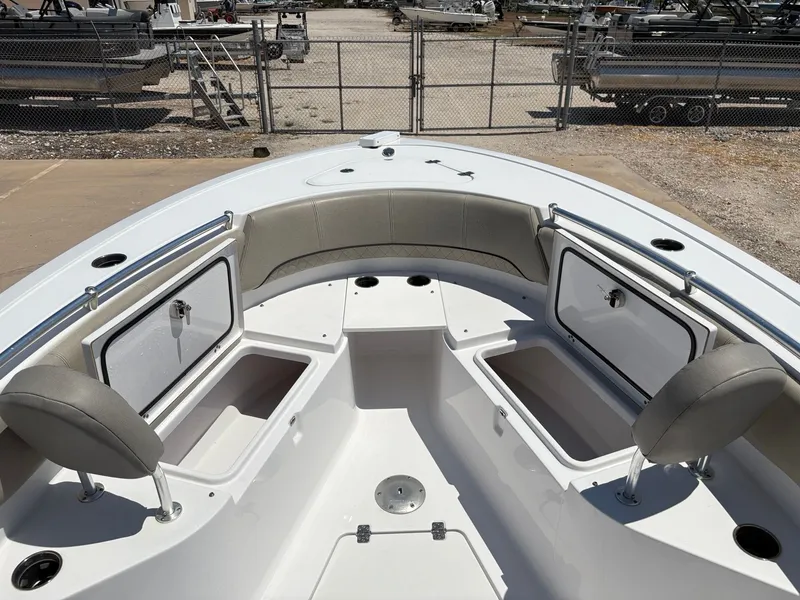 Slide: The Image of 2021 Sportsman Heritage 241 Center Console boat interior with open storage compartments. - 28