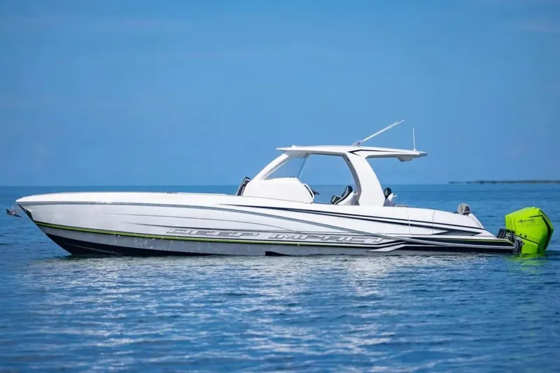 Slide: The Image of 2026 Deep Impact 399 Sport boat on calm blue water. - 10