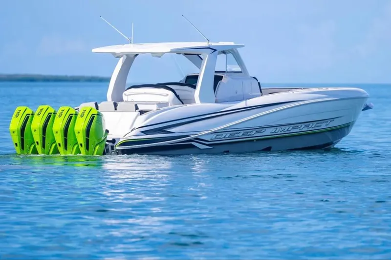 Slide: The Image of 2026 Deep Impact 399 Sport boat with four green outboard motors on calm water. - 14