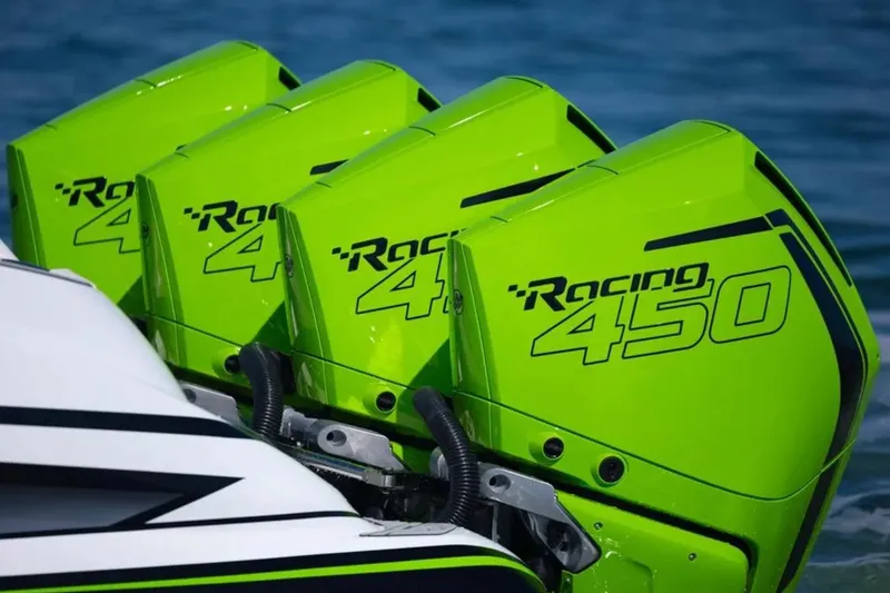 Slide: The Image of Bright green Racing 450 outboard engines on a 2026 Deep Impact 399 Sport boat. - 3