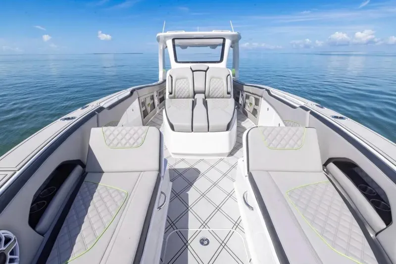 Slide: The Image of Luxury interior of 2026 Deep Impact 399 Sport boat on calm ocean waters. - 35