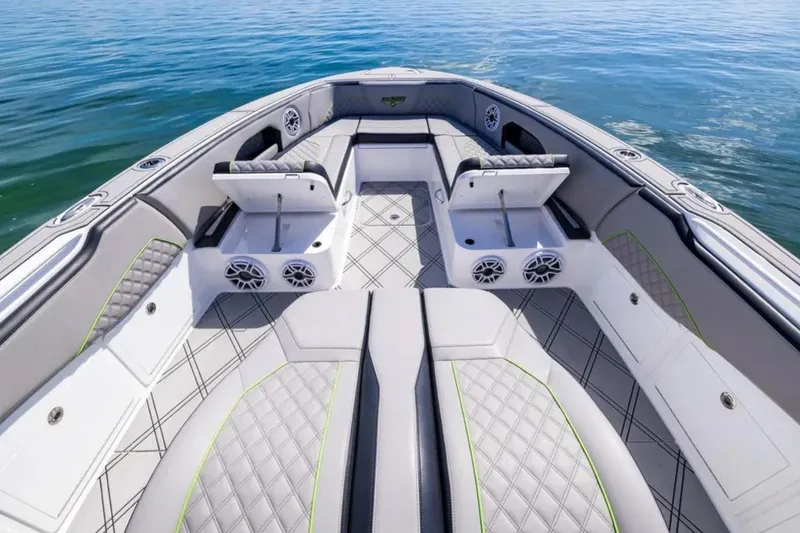 Slide: The Image of Luxurious 2026 Deep Impact 399 Sport boat interior with stylish seating and speakers on calm water. - 37