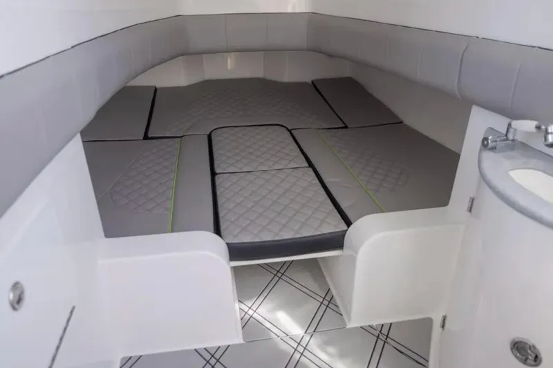 Slide: The Image of Interior cabin of 2026 Deep Impact 399 Sport boat, featuring cushioned seating and modern design. - 42