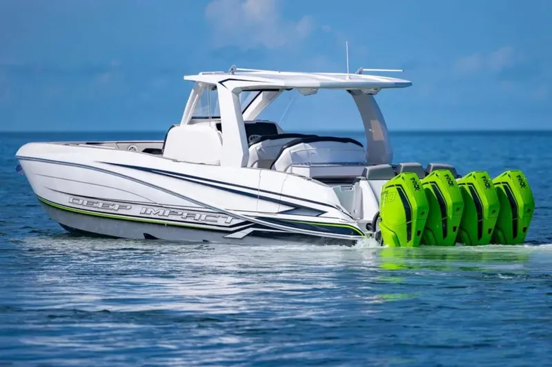 Slide: The Image of 2026 Deep Impact 399 Sport boat with four green outboard motors on the water. - 5