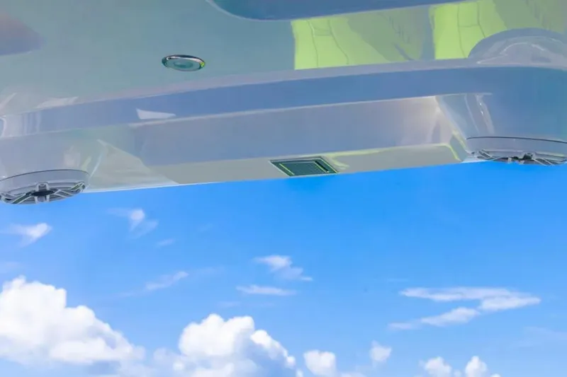 Slide: The Image of Underneath view of 2026 Deep Impact 399 Sport boat against a clear blue sky. - 53