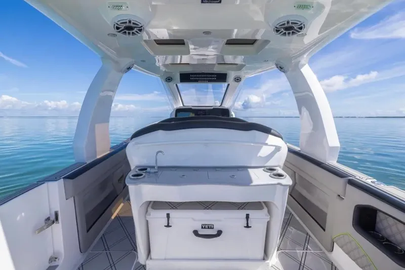 Slide: The Image of Interior view of 2026 Deep Impact 399 Sport boat on calm ocean waters. - 54