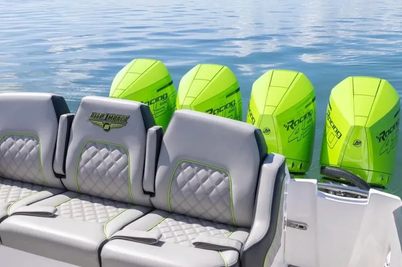 Slide: The Image of 2026 Deep Impact 399 Sport boat with four vibrant green outboard engines. - 58