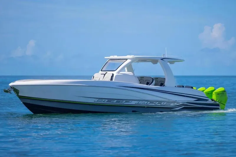 Slide: The Image of 2026 Deep Impact 399 Sport boat cruising on clear blue water. - 6