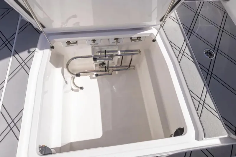 Slide: The Image of Open storage compartment on 2026 Deep Impact 399 Sport boat, featuring sleek interior design. - 60